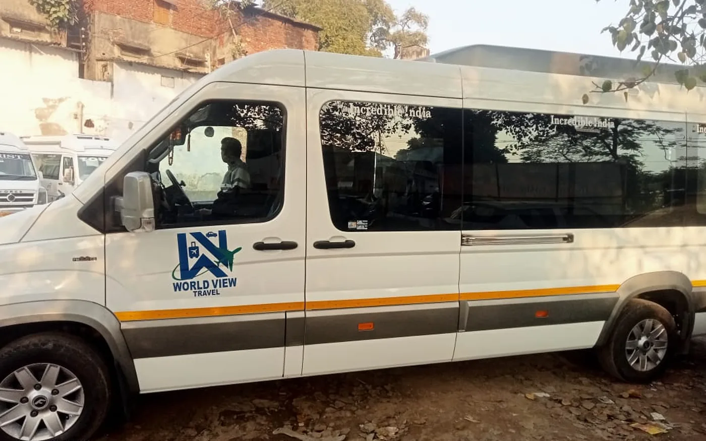 A white Force Urbania luxury van, the vehicle used for corporate and client travel in Varanasi
